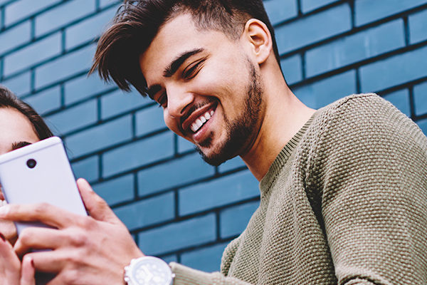 friends looking at phone